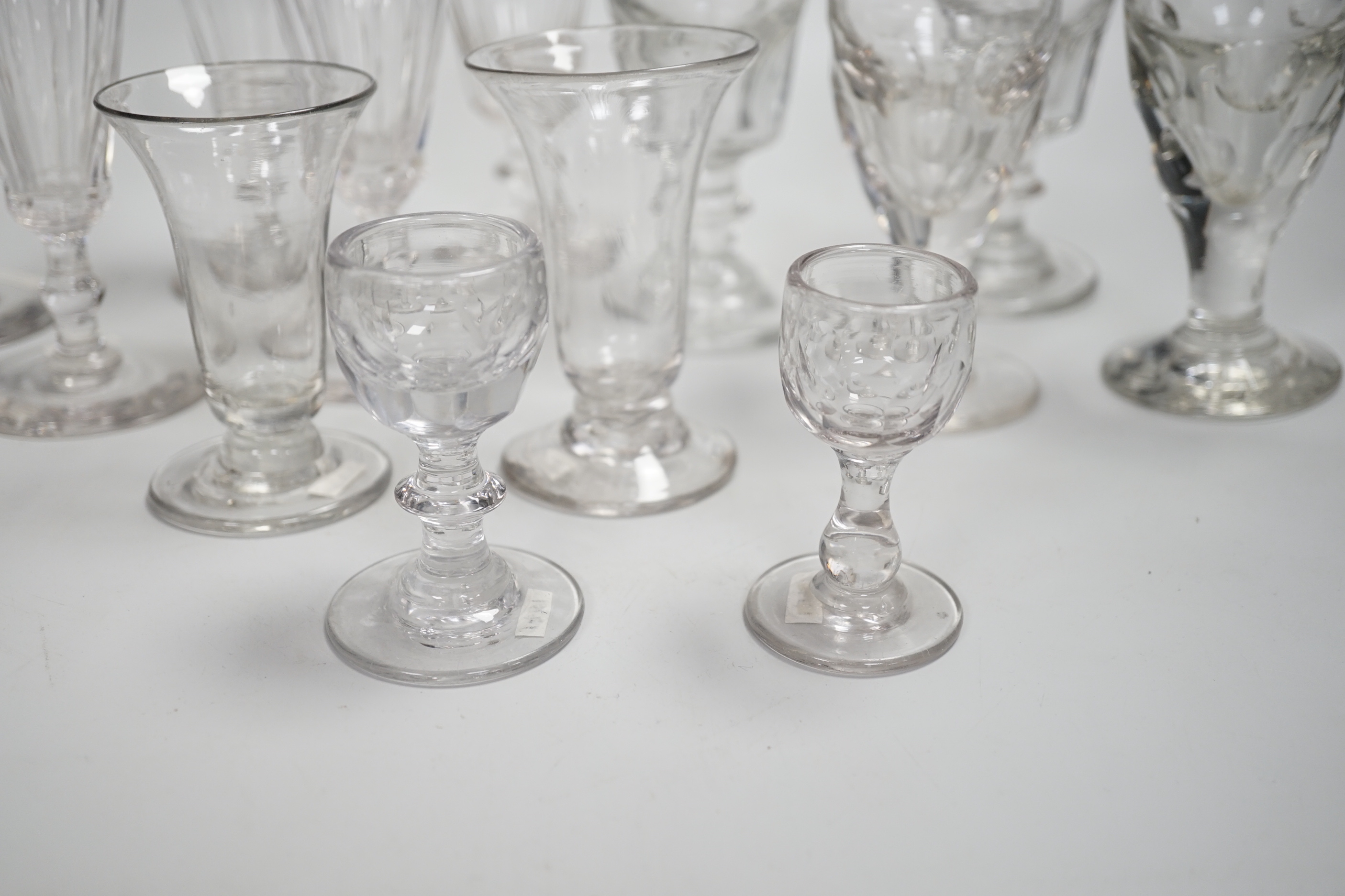 1429, 1430, 1451, 1439 & 1435 A harlequin set of five English lead crystal short ales, c.1820-30, decorated with cut rounded facets, two with blade and three with ball knops, height 14.2cm, together with three pairs of 1